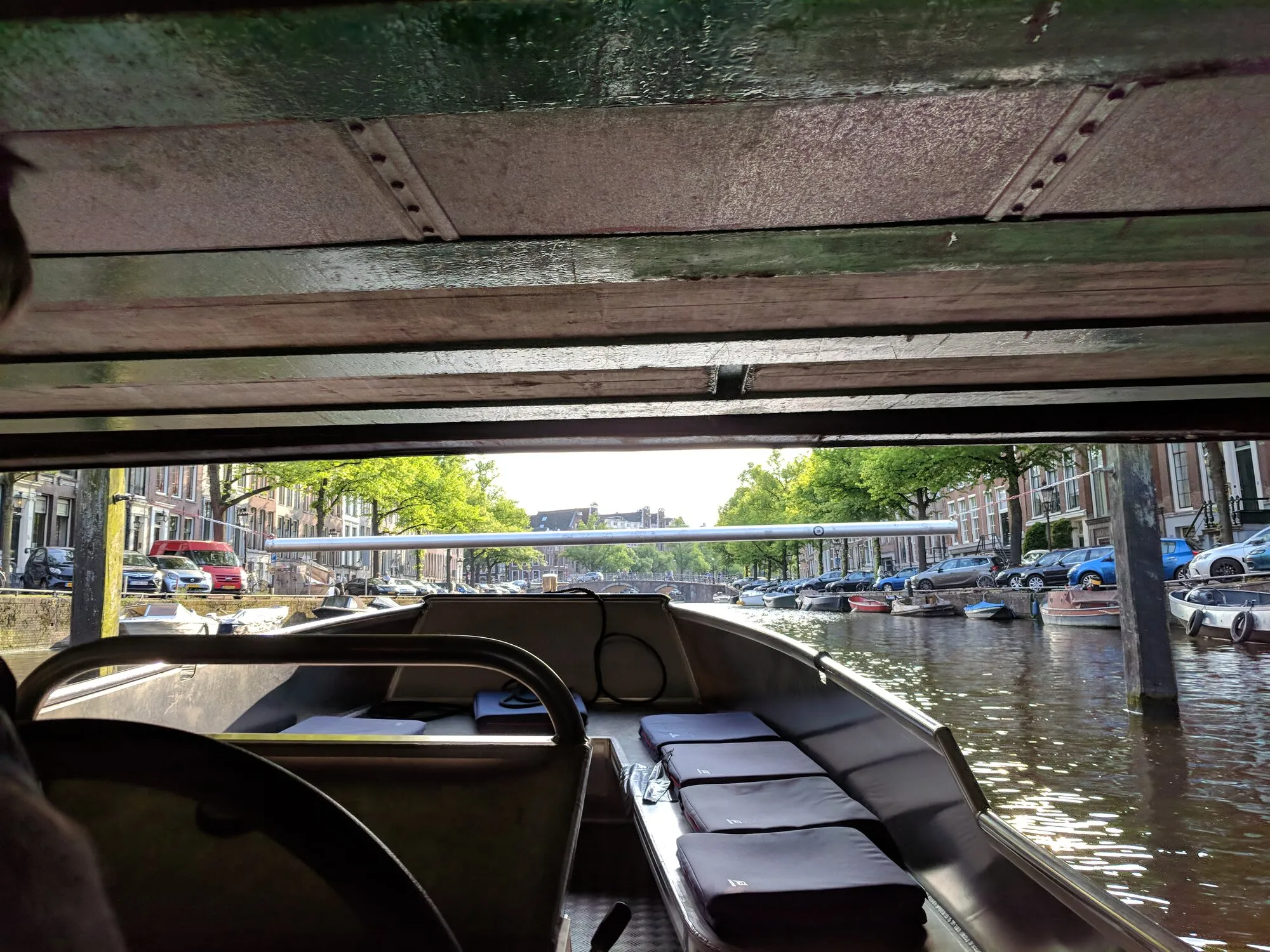 A boat under the pretty low bridge