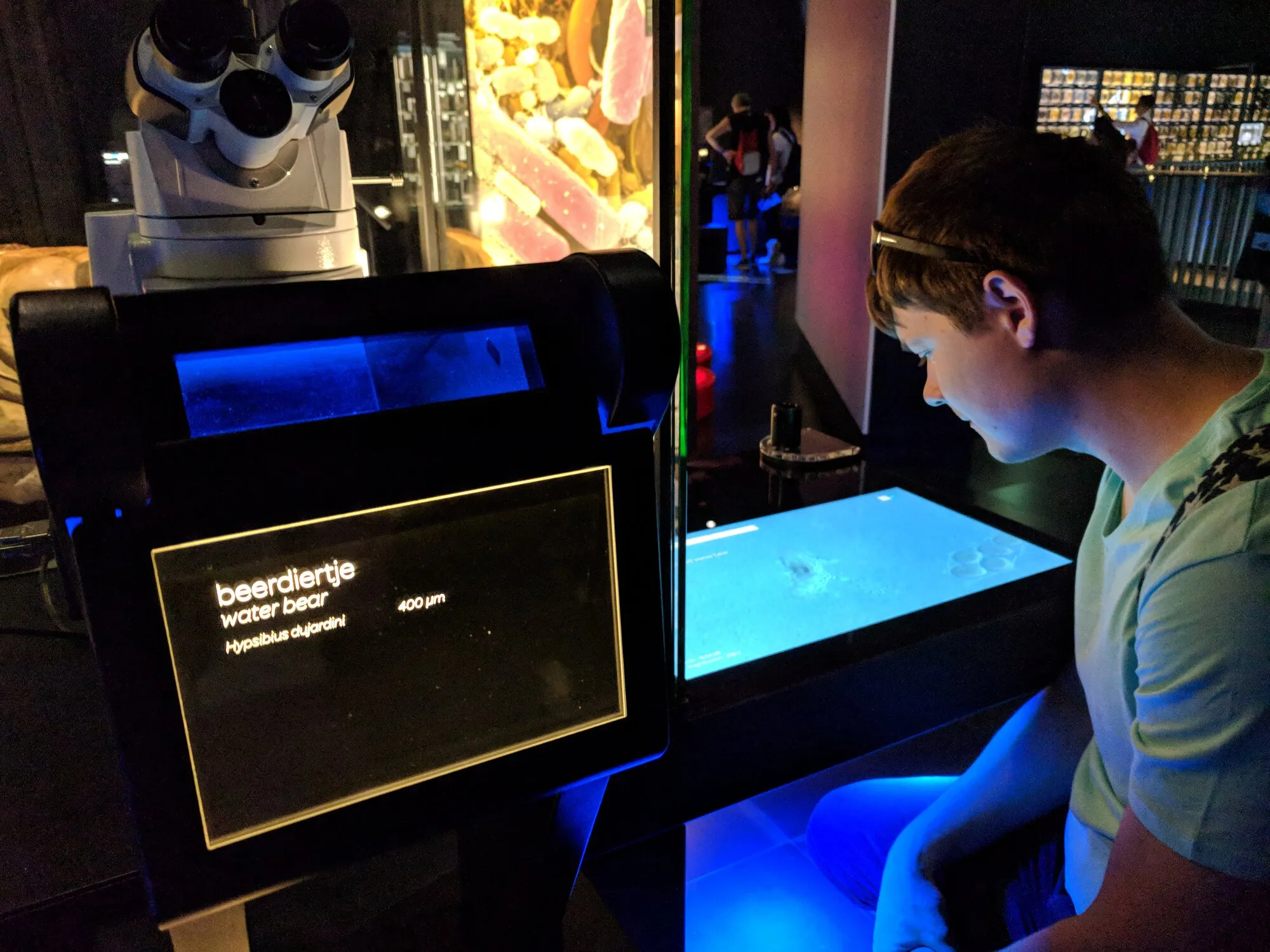 Dima looking at microbes under electronic microscope